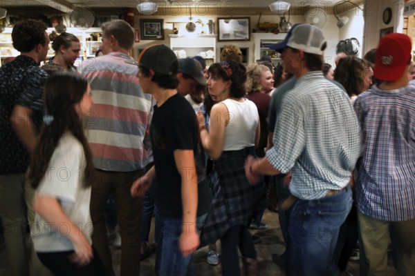 Young people dance heartily at Floyd Country Store during an evening jamboree, Floyd, Virginia, USA