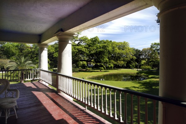 Elegant veranda overlooking a lush garden, zero
