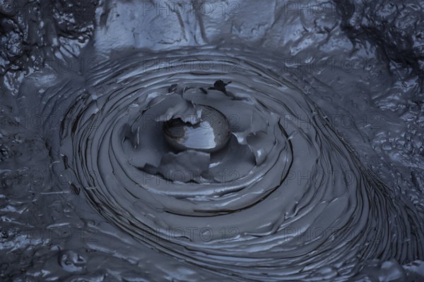 Blowing mud hole in the Whakarewarewa geothermal area in Rotorua, Rotorua, New Zealand