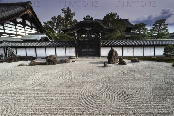 Zen garden with gate and detailed gravel patterns in Tofuku-ji Temple