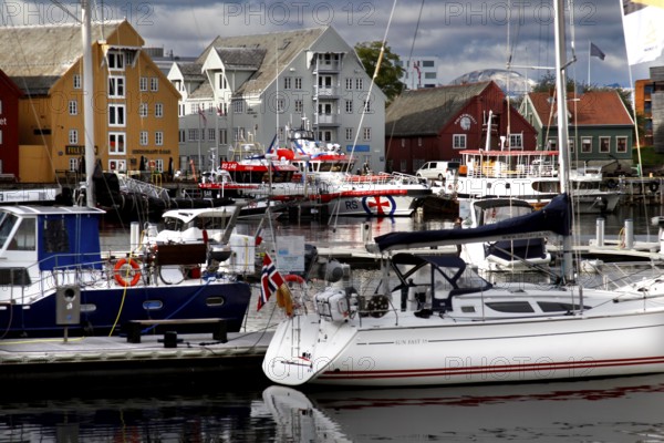 View of the marina in Tromsø city center with colorful buildings, Tromsø, Norway