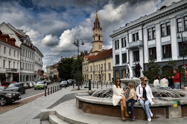 Bustling Town Hall Square, Rathausplatz, Rathausplatz in Vilnius with fountain and St. Nicholas Church in the background, Vilnius, Vilnius County, Lithuania