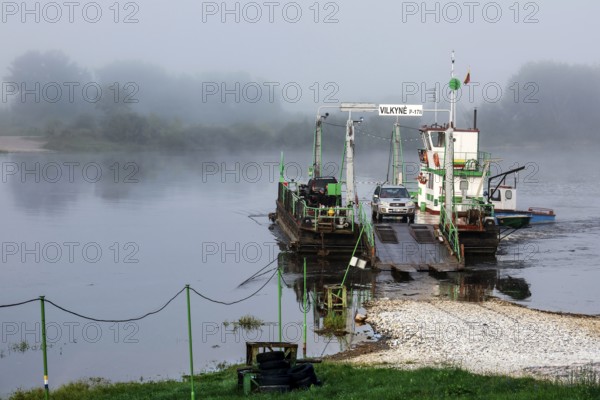 Ferry in thick fog on the Nemunas river near Vilkija, Vilkija, Lithuania