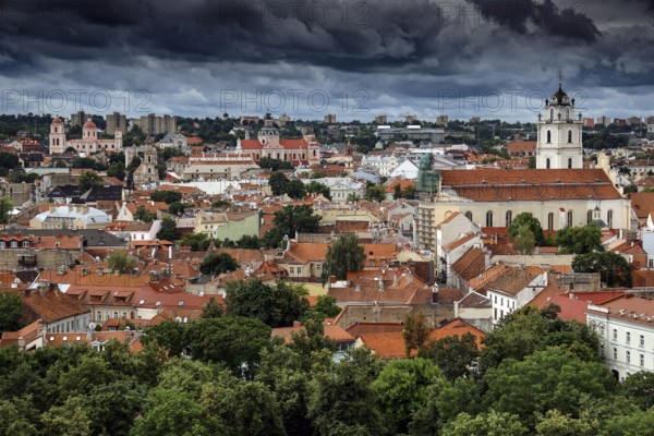 View of the old town of Vilnius from Gediminas Hill with dramatic clouds, Vilnius, Lithuania