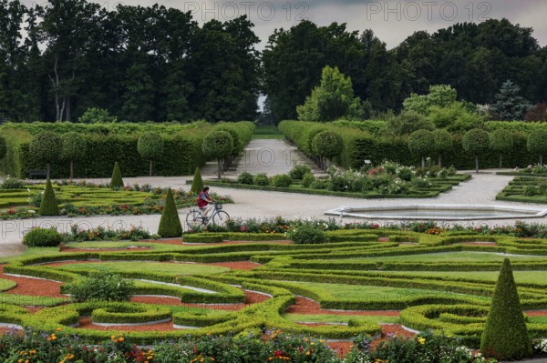 Magnificent baroque garden with symmetrical hedges and green backdrop, Rundale, Latvia