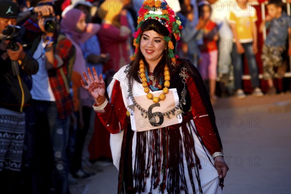 Woman in festive dress parading during the Fête des Roses, El Kelâa m'Gouna, Marrakesh-Safi, Morocco