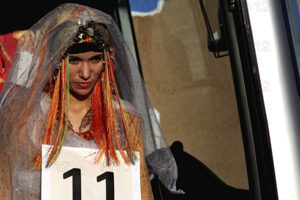 A woman in festive dress at the Miss Election during the Fête des Roses, El Kelâa m'Gouna, Marrakesh-Safi, Morocco