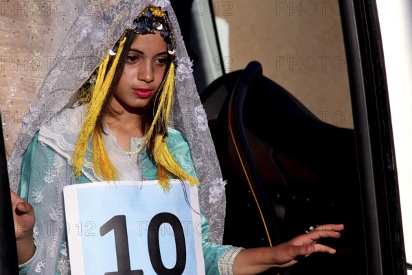 Participant in the Miss Voting at the Fête des Roses in traditional dress, El Kelâa m'Gouna, Marrakesh-Safi, Morocco