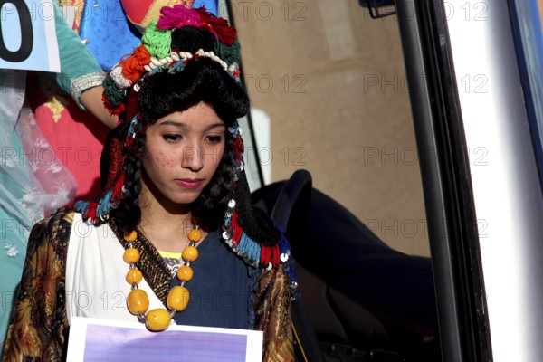 Young woman in traditional dress during the Miss Election at the Fête des Roses, El Kelâa m'Gouna, Marrakesh-Safi, Morocco