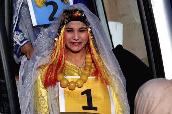 A woman in traditional dress takes part in a miss contest during the Fête des Roses, El Kelâa m'Gouna, Marrakesh-Safi, Morocco