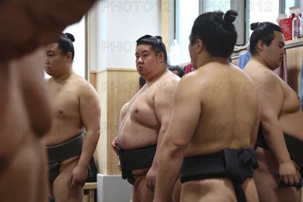 Sumo wrestlers stand concentrated training at Ryogoku Center, Tokyo, Ryogoku, Japan