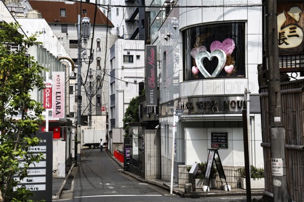 Street scene with hotel with heart window, Tokyo, zero, Japan