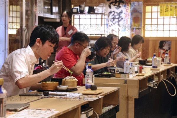 People enjoying meal at traditional restaurant in Ryogoku, Tokyo, Ryogoku, Japan