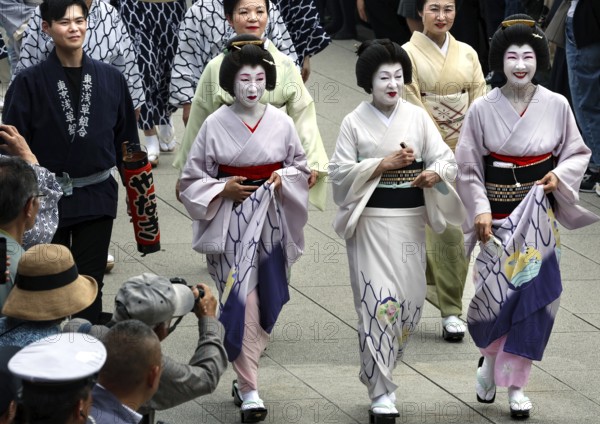 Geishas in traditional dress at the Daigyoretsu Parade at Senso-ji in Tokyo, Tokyo, Japan