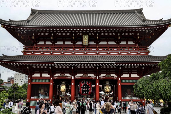 Entrance gate of Senso-ji Temple with crowd, traditional Japanese design, Tokyo, Japan