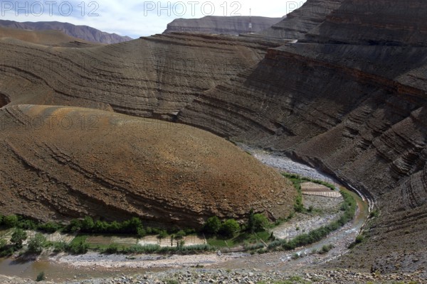 Stratified geological formations in Dadès Canyon with a river, Dadès Gorge, Morocco