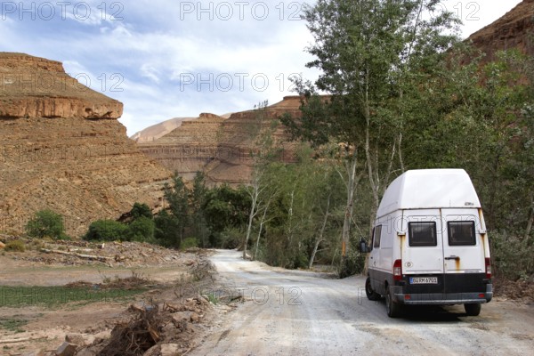 Road with a vehicle leads through the impressive scenery of the Dadès Gorge, Dadès, region, MA