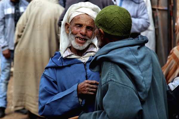 Lively market with traditionally dressed people near Achaouikh, Achaouikh, Morocco