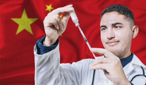 Doctor holding syringe on China flag background. Medical professional holding syringe with Chinese flag in the background