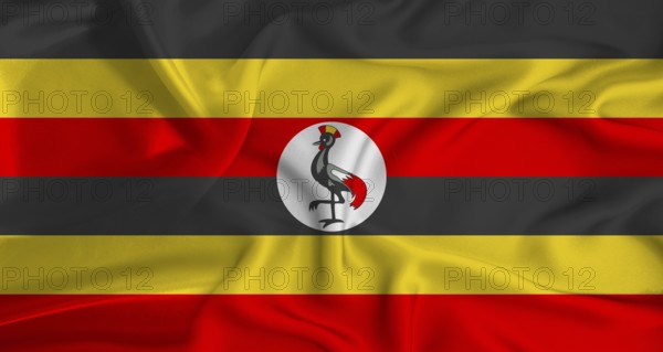 Realistic Uganda flag waving. Close up of flag of Uganda with cloth texture