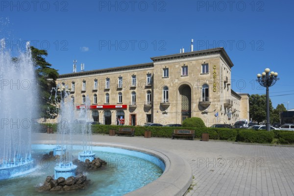 Classic building with fountain and beautiful summer atmosphere under blue skies, Stalin Park and Hotel Inturist Gori, Inner-Kartli region, Georgia