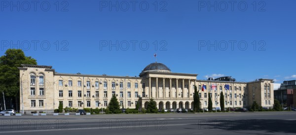 Extensive classical building in panoramic view under bright blue sky, City Hall, Gori, Inner Kartli Region, Georgia
