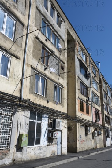 Multi-storey apartment unit with visible cables and worn exterior façade, Gori, Inner Kartli region, Georgia