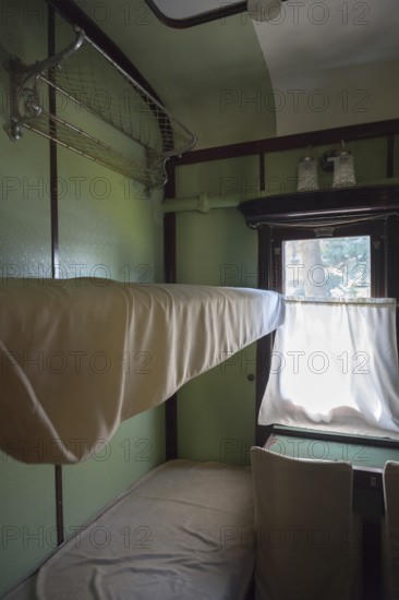 Interior of a historic train compartment with beds and curtains on the windows, Stalin's personal railroad car, Gori, Inner-Kartli region, Georgia