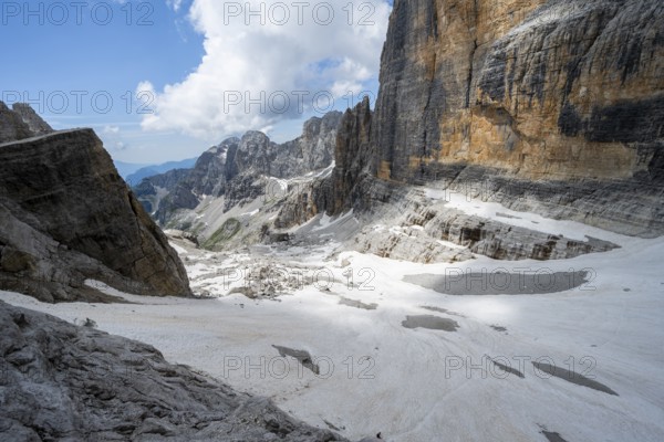 Spectacular mountain landscape with steep cliffs and remains of the Vedretta d'Ambiez glacier, Via Ferrata Brentari via ferrata, Brenta Mountains, Parco Naturale Brenta-Adamello, Trentino, Italy