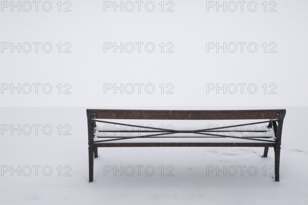 Bench in snow, wintery Turku or Swedish Åbo, Varsinais-Suomi, Finland