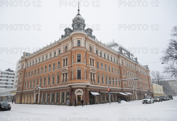 Historic building on the corner of Linnankatu Aurakatu, snowy roads, Turku or Swedish Åbo, Varsinais-Suomi, Finland