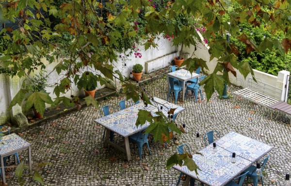 Empty tables in a garden restaurant in Sintra, Lisbon, Ortugal