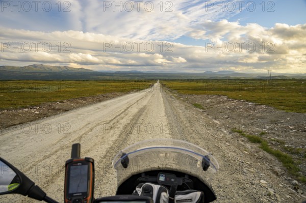 Falkvålen, Bruksvallarna, Jämtland, Sweden, Scenic view along an empty road with BMW G 650 GS Sertao Enduro motorcycle and wide sky in the background