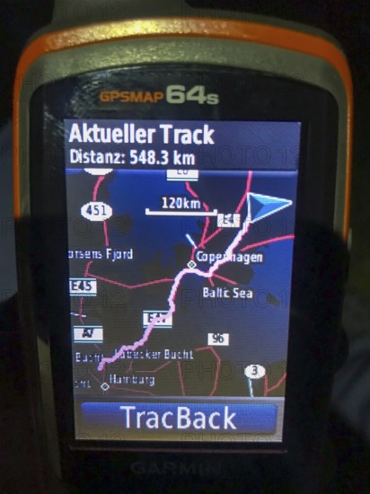 Växjö, Kronobergs län, Sweden, evening view of a GPS device with a mapped route and information about the current route