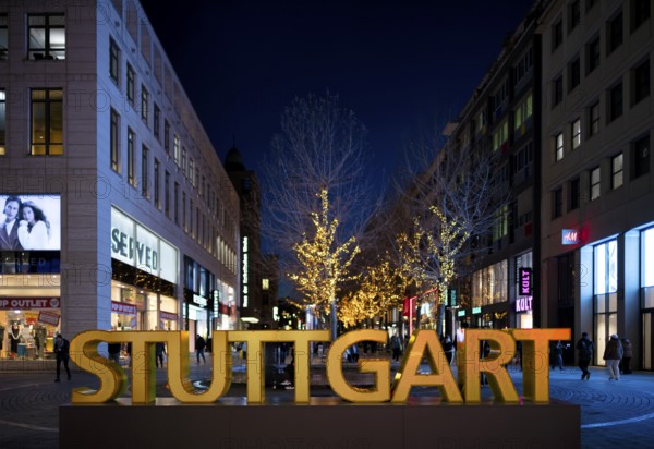 Night shot logo lettering STUTTGART people, passers-by, Königsstraße, Schlossplatz, pedestrian zone, city, Christmas decoration, Christmassy, Stuttgart, Baden-Württemberg, Germany