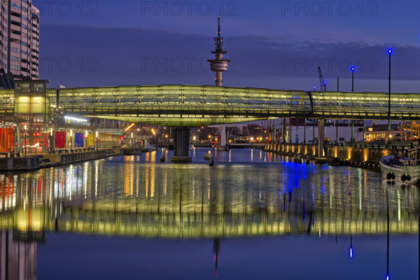 Occidental city view with illuminated bridge and tower in the background