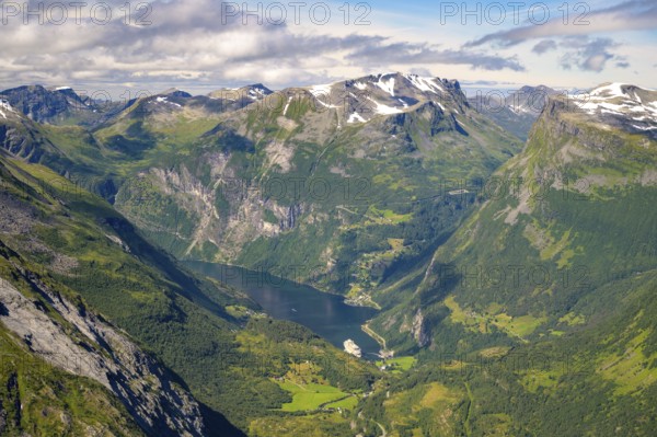 Geiranger, Møre og Romsdal province, Norway, view of the Geiranger fjord with a cruise ship nestled in a wide mountain valley, highest fjord view in Europe from the Geiranger Skywalk