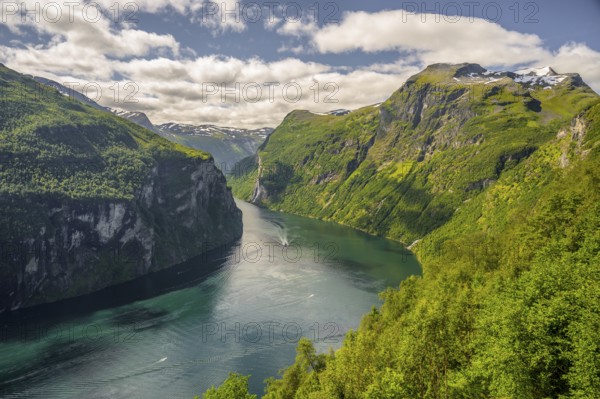 Geiranger, Møre og Romsdal Province, Norway, Majestic Geiranger Fjord with turquoise water and steep green mountain slopes
