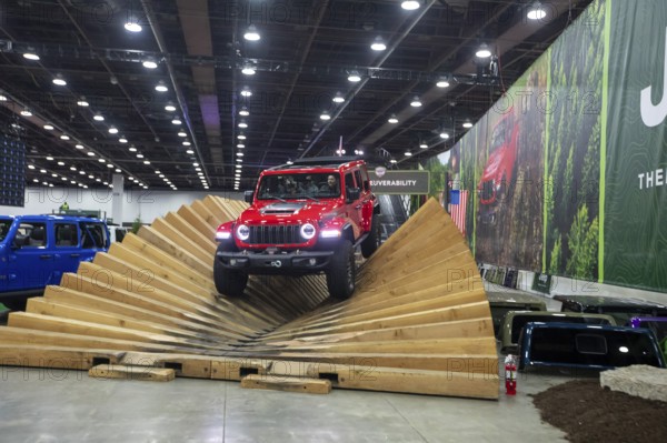 Detroit, Michigan USA - 15 January 2026 - A Jeep Rubicon takes visitors on a track that displays the car's off-road capability at the Detroit Auto Show