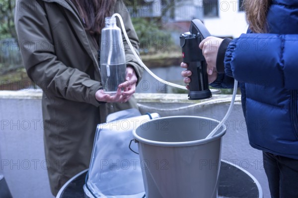 Symbolic picture blackout, extensive, prolonged power failure, in the private environment, without electricity, the water supply also fails, rainwater is made drinkable with the help of a water filter