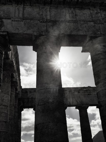 Elymian Doric Temple, ruin, monochrome, sunbeams, ancient city of Segesta, archaeological site, Calatafimi, Trapani province, northwest, Sicily, southern Italy, Italy