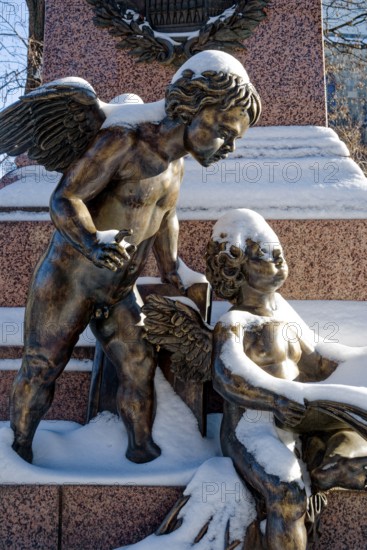 Two snowy angels, figure at the Felix Mendessohn Bartholdy monument in winter with snow, Leipzig, Saxony, Germany