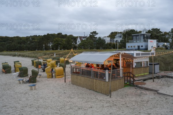 Illuminated beach bar, dusk, Binz, seaside resort, Rügen island, Baltic Sea, Mecklenburg-Western Pomerania, Germany