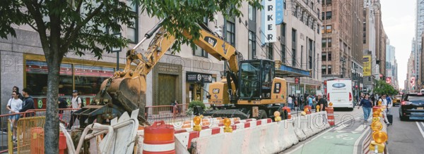 Excavator in front of the New Yorker Hotel, New York, USA