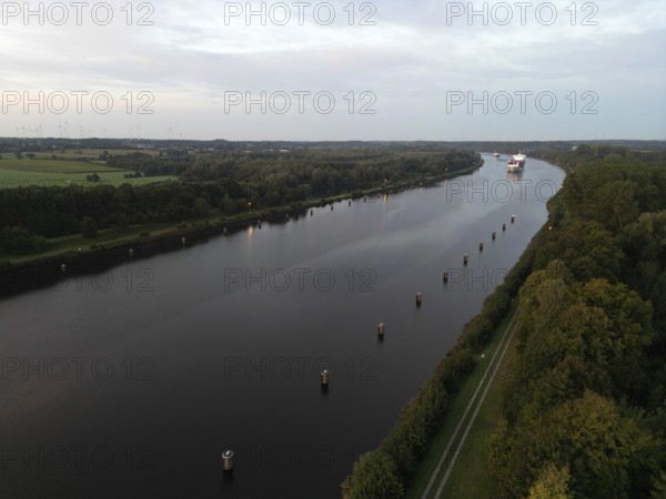 Drone shot, container ship at sunrise in the Kiel Canal, NOK, Kiel Canal, Kiel Canal, Schleswig-Holstein, Germany
