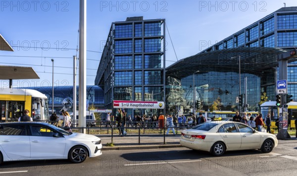Berlin road traffic with buses, trams and pedestrians at and around the main train station, Berlin, Germany