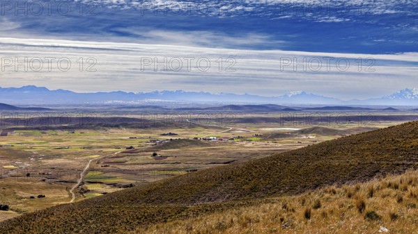 View of hilly landscape with cloudy sky, The Altiplano landscape in the Andes of Bolivia