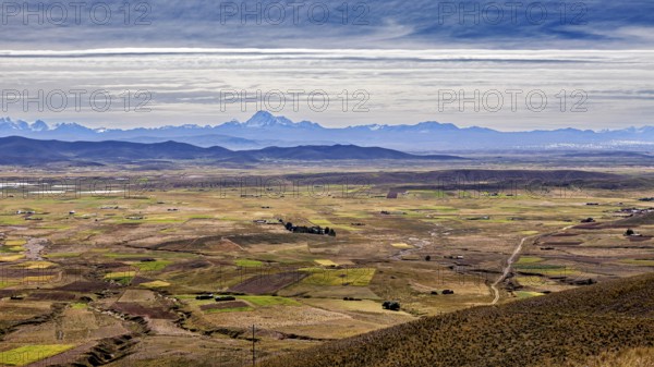 View over a wide plain with mountains in the distance, The Altiplano landscape in the Andes of Bolivia