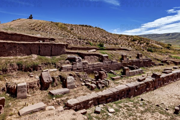 Historic ruins with terraces in rocky landscape under a clear sky, The archaeological site with the ruins of Tiwanaku in Bolivia