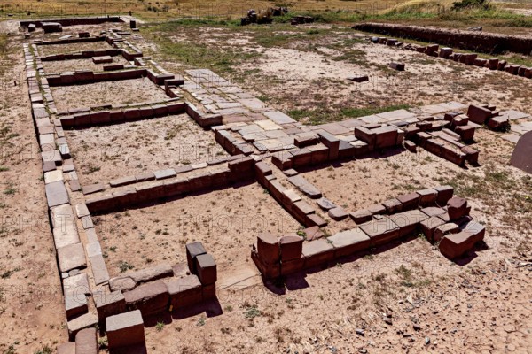 Floor plans of stone ruins in an open area under clear skies, The archaeological site with the ruins of Tiwanaku in Bolivia